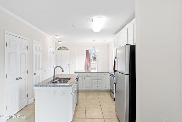 kitchen featuring white cabinets, a kitchen island with sink, light tile patterned flooring, sink, and stainless steel appliances