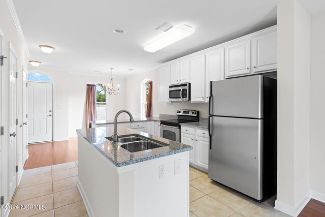 kitchen featuring white cabinetry, stainless steel appliances, and sink