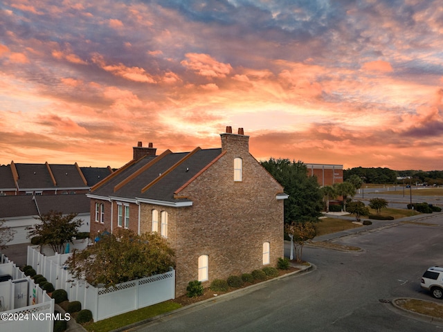 view of property exterior at dusk