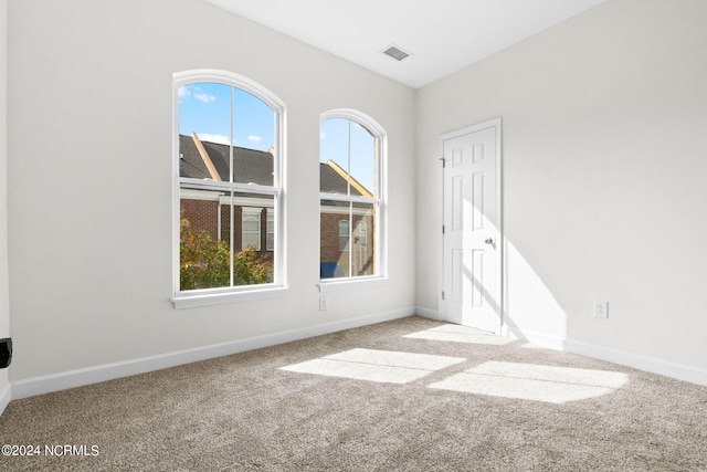 unfurnished room featuring carpet floors