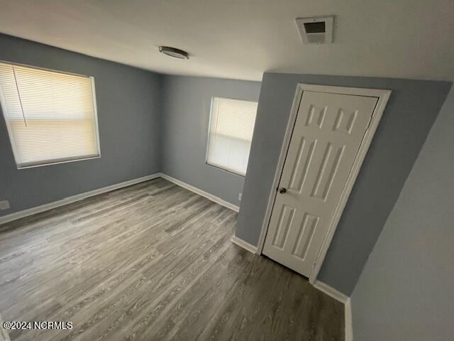 spare room featuring hardwood / wood-style floors