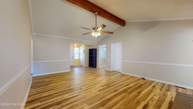 empty room featuring ornamental molding, ceiling fan, vaulted ceiling with beams, and light hardwood / wood-style flooring