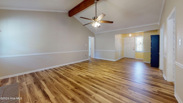 spare room with lofted ceiling with beams, ornamental molding, ceiling fan, and light hardwood / wood-style flooring