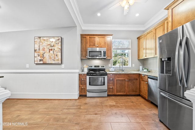 kitchen featuring ceiling fan, sink, light stone countertops, and stainless steel appliances