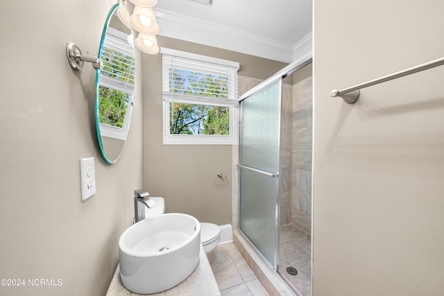 bathroom with tile patterned floors, an enclosed shower, crown molding, sink, and toilet