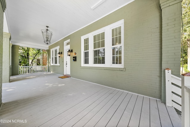 wooden terrace with covered porch