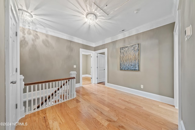 bedroom featuring crown molding, a chandelier, and hardwood / wood-style flooring