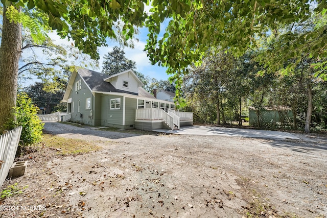 back of property featuring a deck