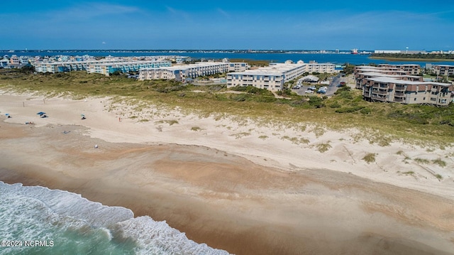 aerial view featuring a water view and a view of the beach