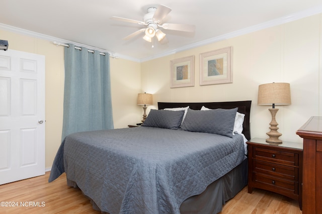 bedroom featuring light hardwood / wood-style flooring and crown molding