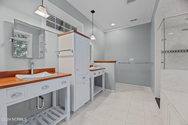 bathroom with crown molding, tile patterned flooring, vanity, and tiled shower