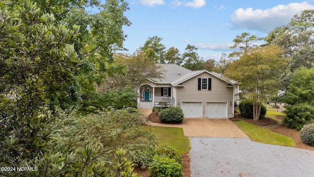 view of front of home featuring a porch and a garage