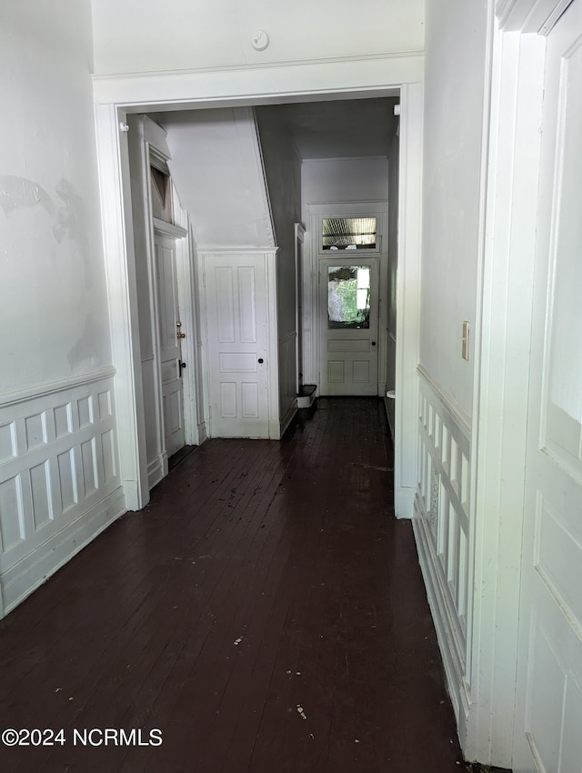 corridor featuring dark hardwood / wood-style flooring