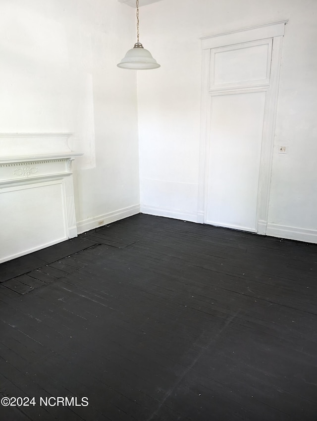 empty room with dark wood-type flooring