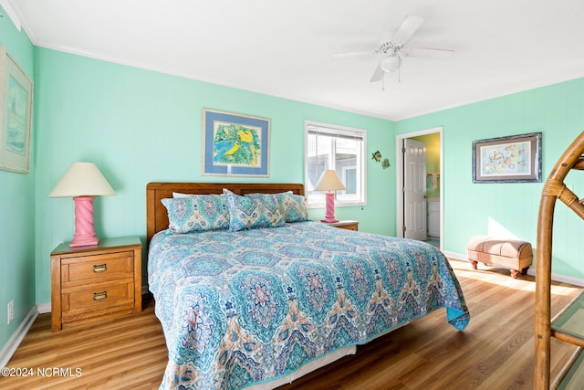 bedroom with ensuite bathroom, ornamental molding, light hardwood / wood-style flooring, and ceiling fan