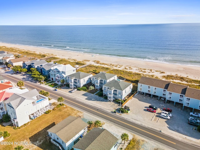 birds eye view of property featuring a view of the beach and a water view