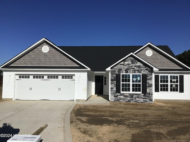 craftsman inspired home featuring a garage