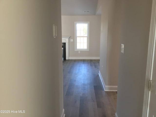 hall with dark hardwood / wood-style floors