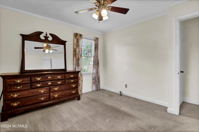 unfurnished bedroom with ornamental molding, light carpet, and ceiling fan