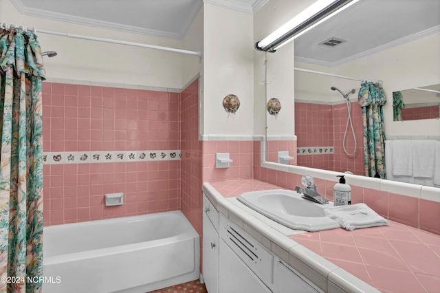 bathroom featuring vanity, crown molding, tile walls, and shower / tub combo