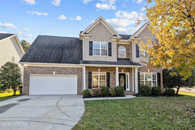 view of front of property featuring a porch and a front lawn