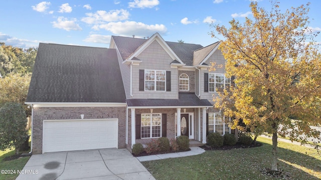 view of front facade with a front lawn and a garage