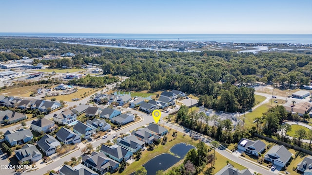 birds eye view of property with a residential view and a water view