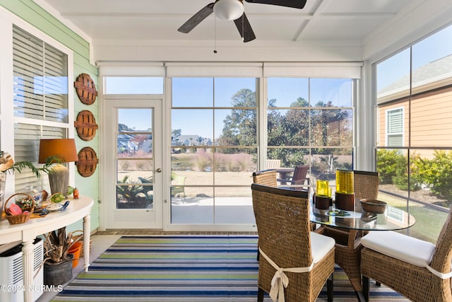 sunroom featuring ceiling fan