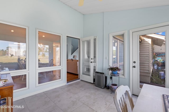 sunroom / solarium with lofted ceiling and plenty of natural light