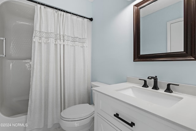 full bathroom featuring vanity, toilet, and shower / bath combination with curtain