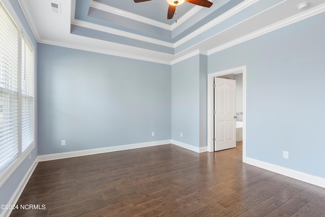 unfurnished room with ceiling fan, crown molding, dark hardwood / wood-style flooring, and a raised ceiling