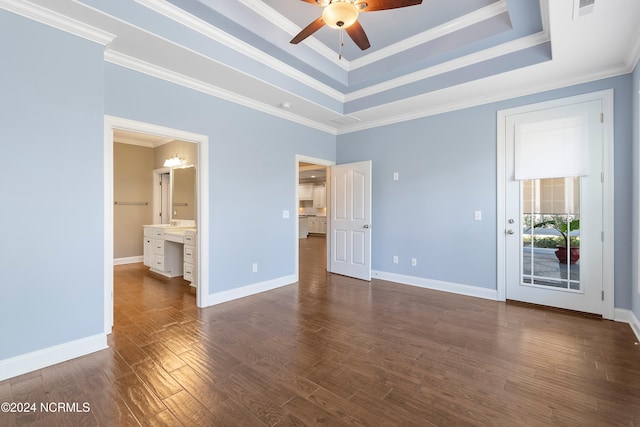 unfurnished bedroom featuring connected bathroom, ceiling fan, ornamental molding, and dark hardwood / wood-style flooring