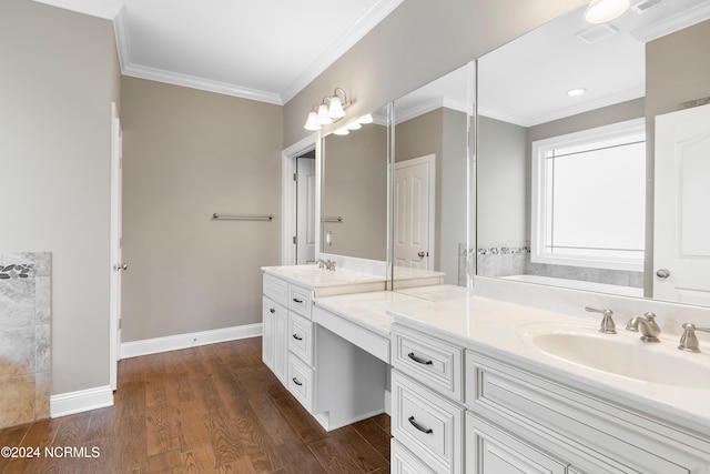 bathroom with vanity, crown molding, and hardwood / wood-style floors