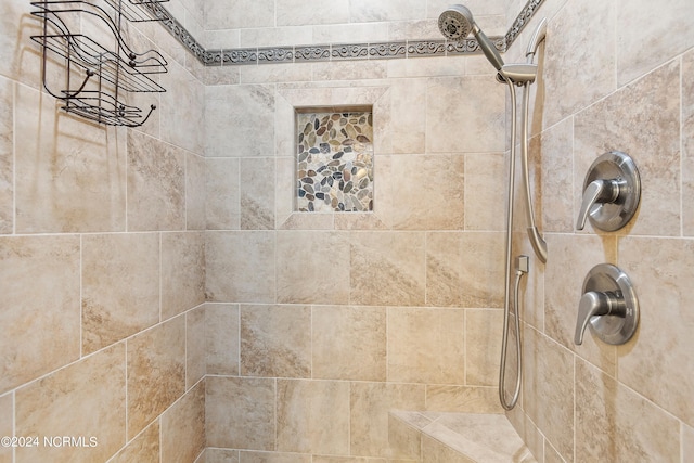 bathroom featuring tiled shower