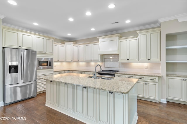 kitchen with sink, light stone counters, stainless steel appliances, and dark hardwood / wood-style flooring