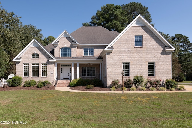 view of front of home featuring a front lawn and a porch