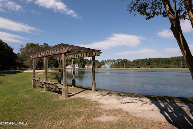 view of dock with a lawn, a water view, and a pergola