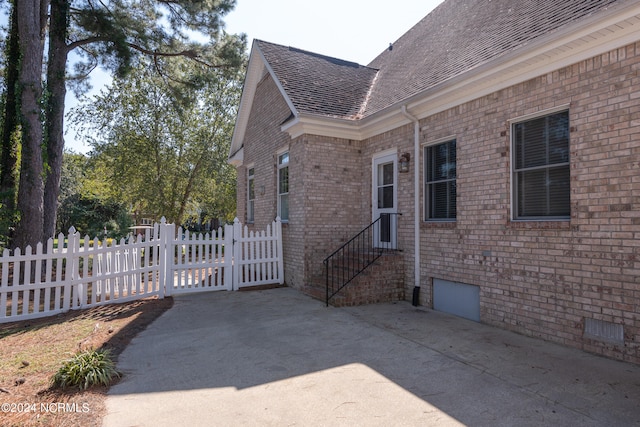 view of side of property with a patio