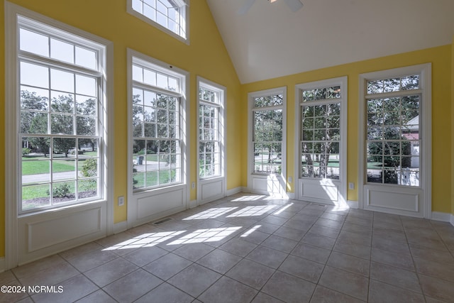 unfurnished sunroom with lofted ceiling and ceiling fan