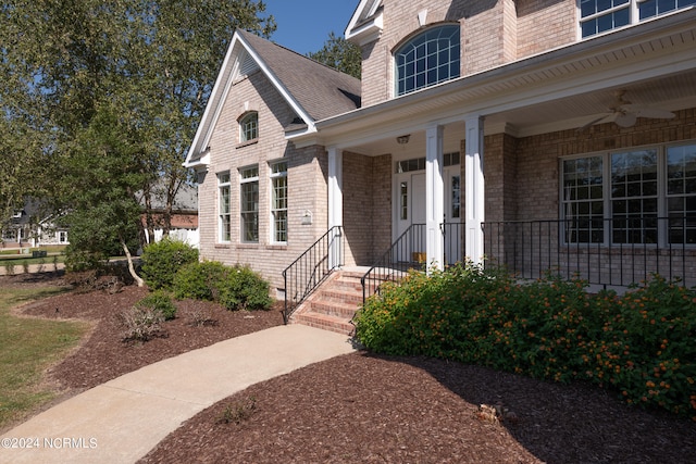 property entrance featuring a porch and ceiling fan