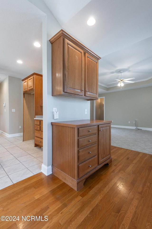 kitchen with ceiling fan and light hardwood / wood-style flooring