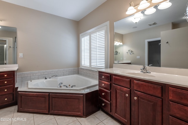 bathroom featuring vanity, plus walk in shower, and tile patterned flooring