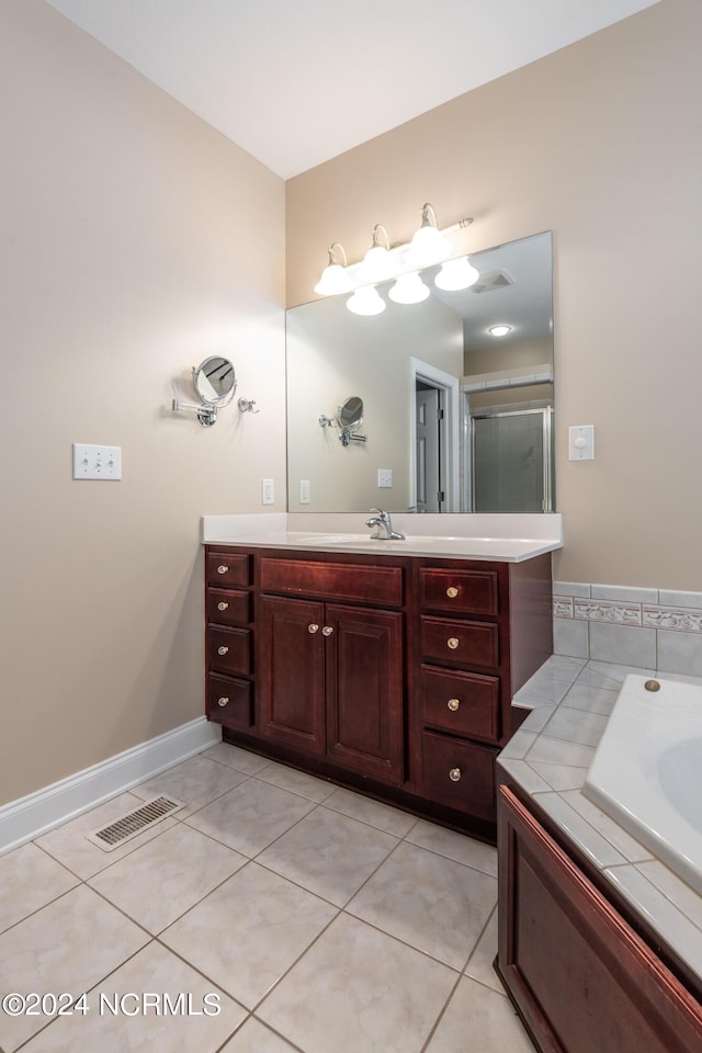 full bath with vanity, visible vents, and tile patterned floors