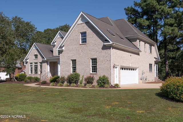 view of front property featuring a front yard and a garage