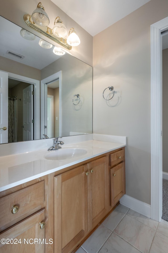 bathroom featuring marble finish floor, visible vents, and vanity