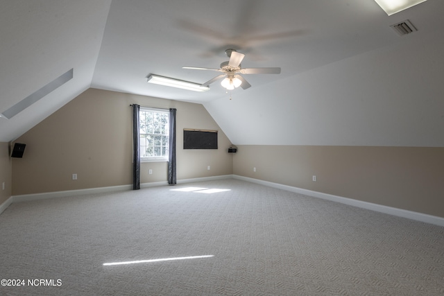 bonus room featuring ceiling fan, carpet flooring, and vaulted ceiling