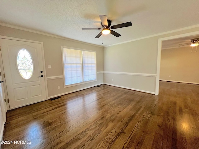 foyer featuring a textured ceiling, ceiling fan, dark hardwood / wood-style floors, and ornamental molding