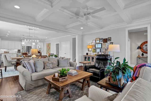 living room with dark wood-type flooring, ceiling fan, ornamental molding, and beam ceiling