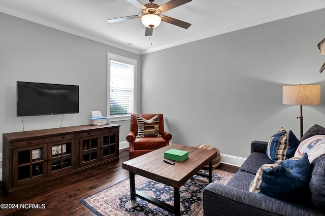 living room with crown molding, dark hardwood / wood-style floors, and ceiling fan