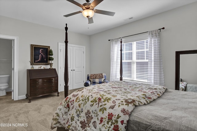 4422 Old Towne St, Wilmington, NC 28412 - bedroom featuring visible vents, light carpet, connected bathroom, baseboards, and ceiling fan